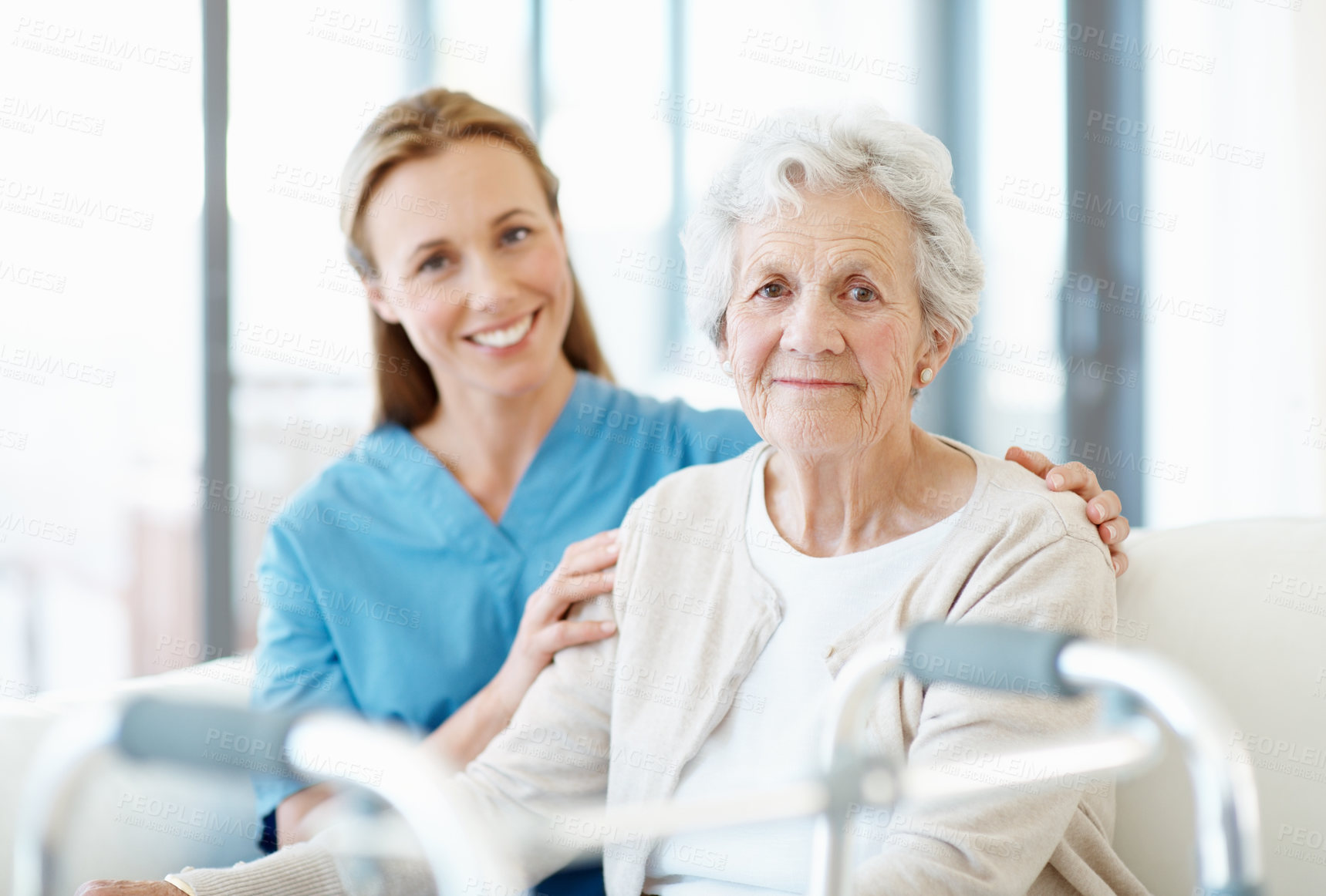 Buy stock photo Smile, caregiver and old woman on couch with walker, assistance and support for rehabilitation. Portrait, nurse and senior person with disability, medical physiotherapy and assisted living at house