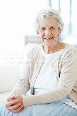 Buy stock photo Happy, portrait and senior woman in house, retirement or comfortable with positive attitude on sofa. Confident, home and elderly person with smile in living room, relax and peaceful holiday in lounge