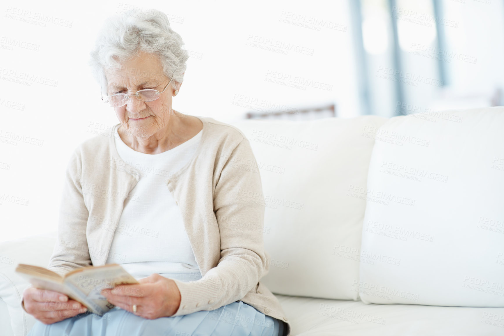 Buy stock photo Relax, book or old woman in lounge with reading, fantasy novel or insight in literature hobby. Chill, glasses or senior person in house with fairytale, peaceful moment or fiction story in retirement.