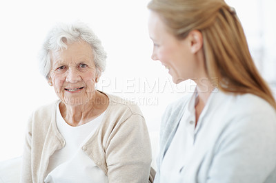 Buy stock photo Care, senior mother and happy daughter in home, support and connection together on weekend break. Elderly parent, women and visit in living room for bonding, relax and family portrait at house