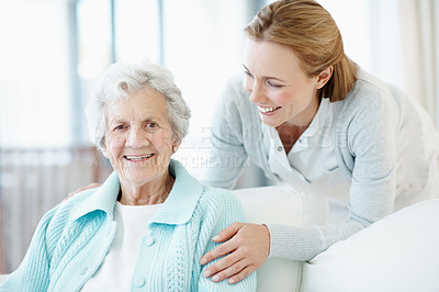 Buy stock photo Happy, relax and old woman at house with daughter, love and  connection for bonding together. Portrait, female person and senior mother with affection, compassion and elderly care for weekend break