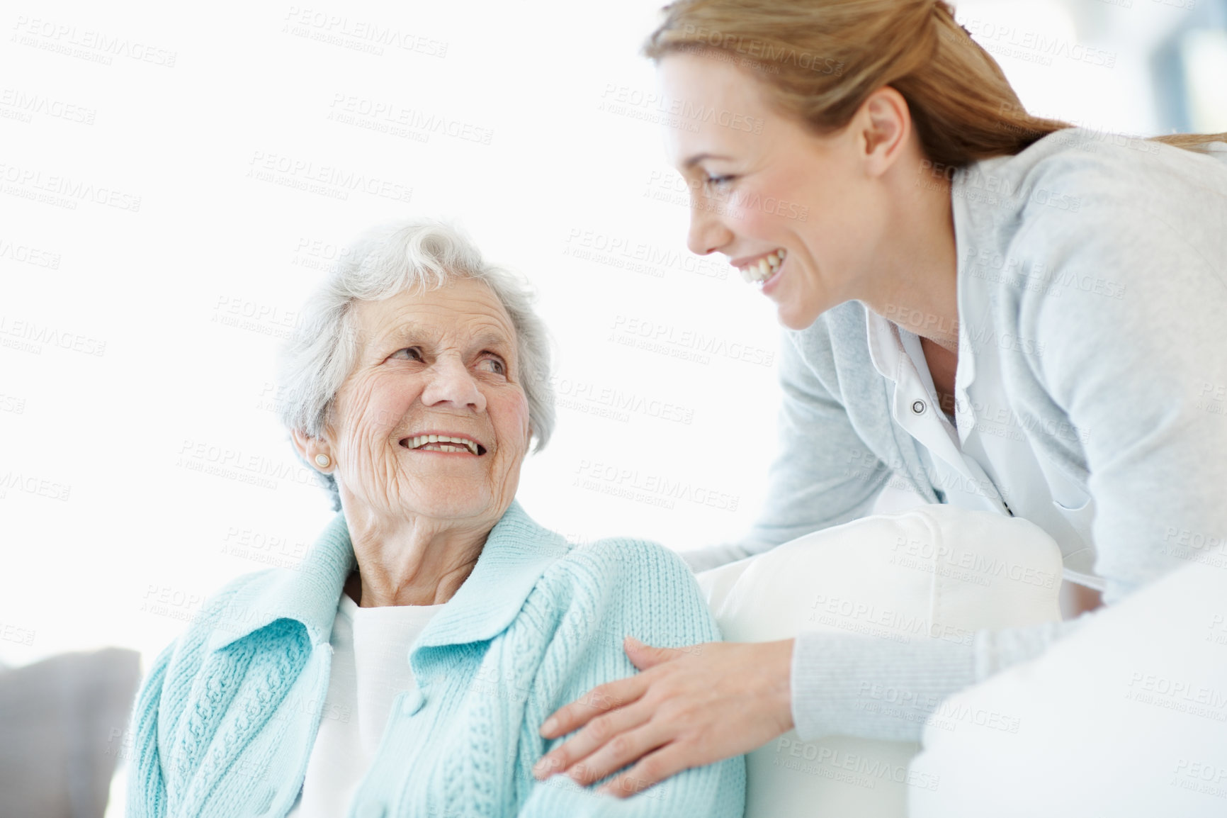 Buy stock photo Care, women and senior mother in home with love, laughing or family talking in living room. Adult daughter, elderly parent and people relax on sofa for support, funny joke or connection in retirement