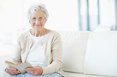 Buy stock photo Relax, portrait or old woman in house with book, fantasy reading or insight in literature hobby. Space, glasses or senior person on sofa with fairytale, peaceful moment or fiction story in retirement