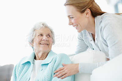 Buy stock photo Support, women and senior mother in home with love, smile or family talking in living room. Adult daughter, elderly parent and people relax on sofa for care, bonding or connection in retirement