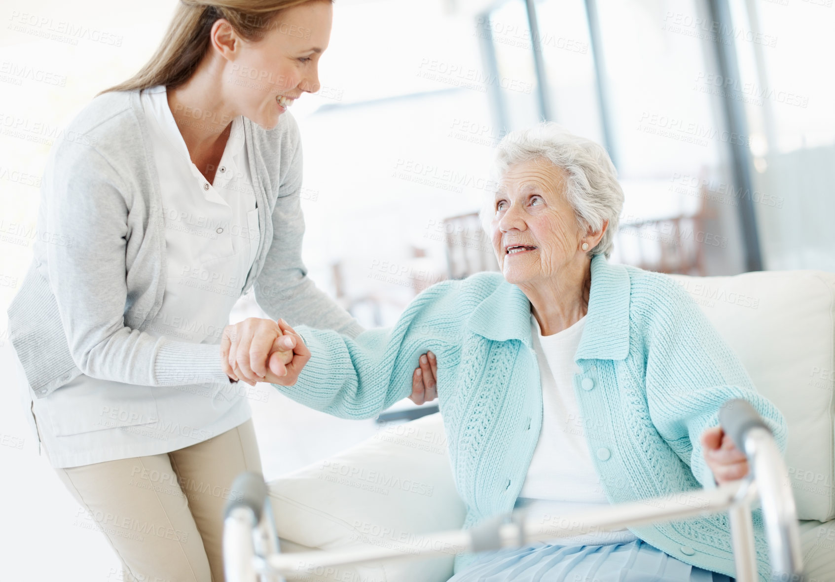 Buy stock photo Wheelchair, volunteer and old woman in facility with helping hand, support and trust in retirement care. Happy, caregiver or senior person with disability, mobility aid or assistance in nursing home.