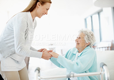 Buy stock photo Wheelchair, caregiver and old woman on sofa with support, helping hand and aid in retirement care. Smile, volunteer and senior person with disability, mobility assistance or kindness in nursing home.