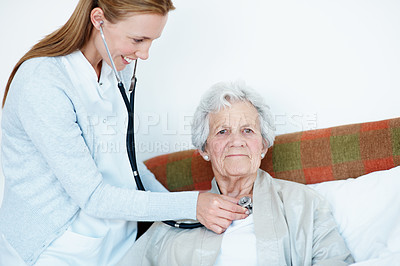 Buy stock photo Doctor, checkup and old woman in bedroom with stethoscope, heart assessment or breathing evaluation. Portrait, healthcare worker and senior person in home with medical equipment, cardiology and help.