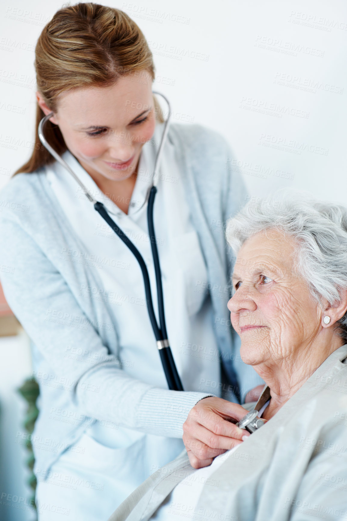 Buy stock photo Doctor, stethoscope and old woman in nursing home for heart rate, listen and breathing evaluation. Elderly person, chest exam and healthcare worker with medical tools, cardiology test and assistance.