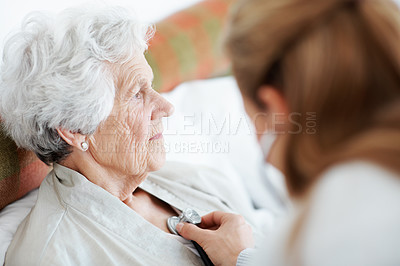 Buy stock photo Nurse, stethoscope and senior woman in bed for homecare, healthcare and listen to heartbeat. Lungs, medical exam and chest evaluation with caregiver and elderly patient in retirement at nursing home