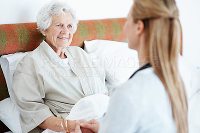 Buy stock photo Trust, caregiver or old woman on bed with holding hands, kindness or empathy in nursing home. Love, volunteer or senior person with support, happy connection or bonding together in retirement care.