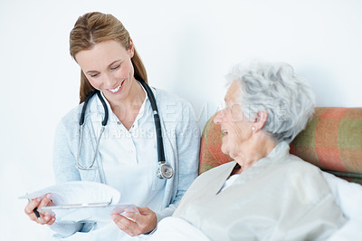 Buy stock photo Smile, caregiver and old woman at house with clipboard, questions and assessment for checkup. Happy, nurse and senior person in bedroom with documents, medical checklist and test results for wellness