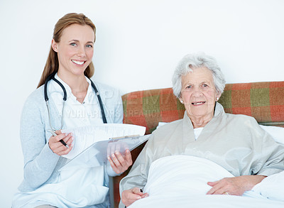 Buy stock photo Caregiver, paperwork and senior woman in bed for homecare, healthcare and checklist with smile. Portrait, happy and medical clipboard for nurse with elderly patient in retirement at  nursing home