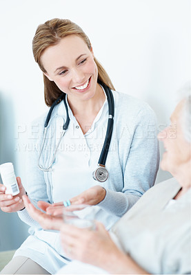 Buy stock photo Nurse, healthcare and elderly woman with pills for healing, recovery or wellness prescription at home. Patient, medical caregiver and giving medicine with water for senior care, help and smile