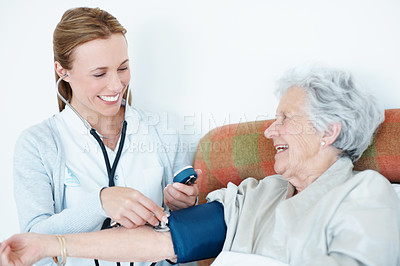 Buy stock photo Doctor, checkup and old woman in bedroom with blood pressure machine, healthcare or hypertension exam. Senior person, medical worker and stethoscope in home visit with assessment, heart rate or smile