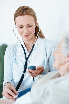 Buy stock photo Doctor, stethoscope and old woman in nursing home with blood pressure machine, healthcare and test. Elderly person, medical worker and tools in consultation with cardiology, heart rate and wellness.