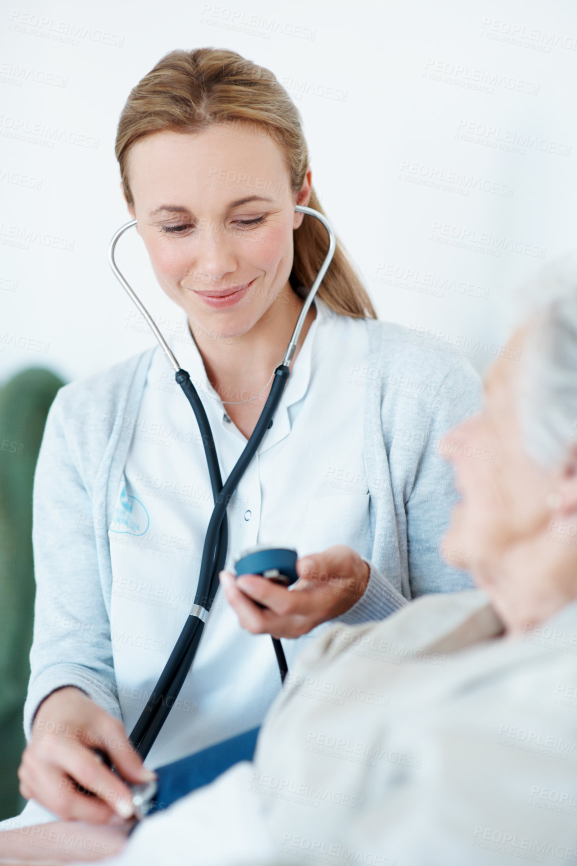 Buy stock photo Doctor, stethoscope and old woman in nursing home with blood pressure machine, healthcare and test. Elderly person, medical worker and tools in consultation with cardiology, heart rate and wellness.