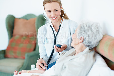 Buy stock photo Doctor, cardiology and old woman in bed with blood pressure machine, stethoscope and healthcare test. Elderly person, medical worker and tools in nursing home for heart rate, assessment and wellness.