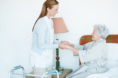 Buy stock photo Wheelchair, caregiver and old woman on bed with helping hand, support or aid in retirement care. Happy, volunteer and elderly person with disability, mobility assistance or service in nursing home.