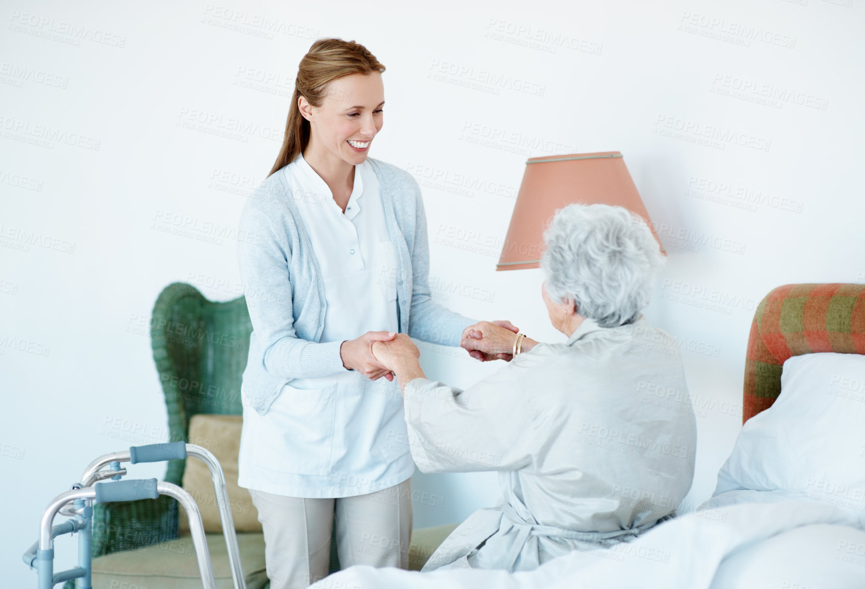 Buy stock photo Walker, volunteer or old woman in bedroom with helping hand, assistance or service in retirement care. Happy, caregiver or senior person with disability, kindness or lifting aid in nursing home.