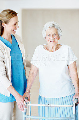 Buy stock photo Caregiver, support and old woman in nursing home with walker, smile and help for stroke rehabilitation. Portrait, nurse and senior person with disability, mobility aid and happy for injury recovery.