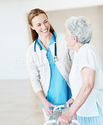Buy stock photo Nurse, help and old woman in clinic with walker, smile and occupational therapy for stroke recovery. Happy, healthcare worker and senior person with disability, mobility aid or injury rehabilitation.