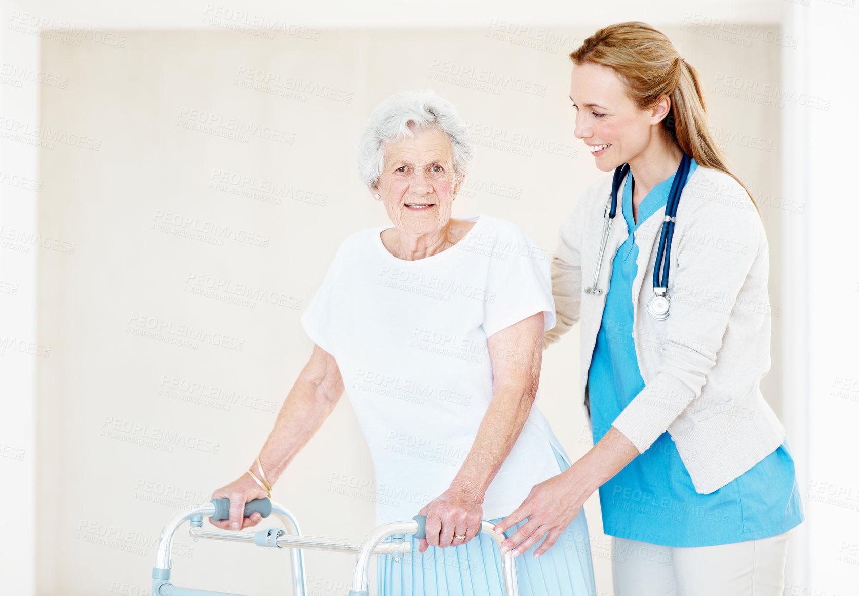 Buy stock photo Assisted living, caregiver and senior woman with walker at home, medical support or rehabilitation. Walking frame, nurse and person with disability, elderly care and portrait for help in retirement
