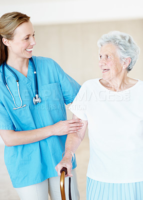 Buy stock photo Nurse, walking stick and support with old woman in home, rehabilitation and talking of healthcare. Cane, caregiver and senior person with disability, medical help or smile for  homecare recovery