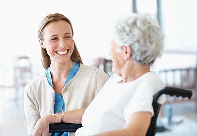 Buy stock photo Caregiver, smile and old woman in retirement home with wheelchair, medical assistance or rehabilitation. Happy, nurse and senior person with disability, consultation and healthcare for wellness.