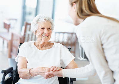 Buy stock photo Caregiver, handshake and old woman in nursing home with wheelchair, greeting or smile for medical help. Healthcare worker, shaking hands and happy senior person with disability, trust or consultation
