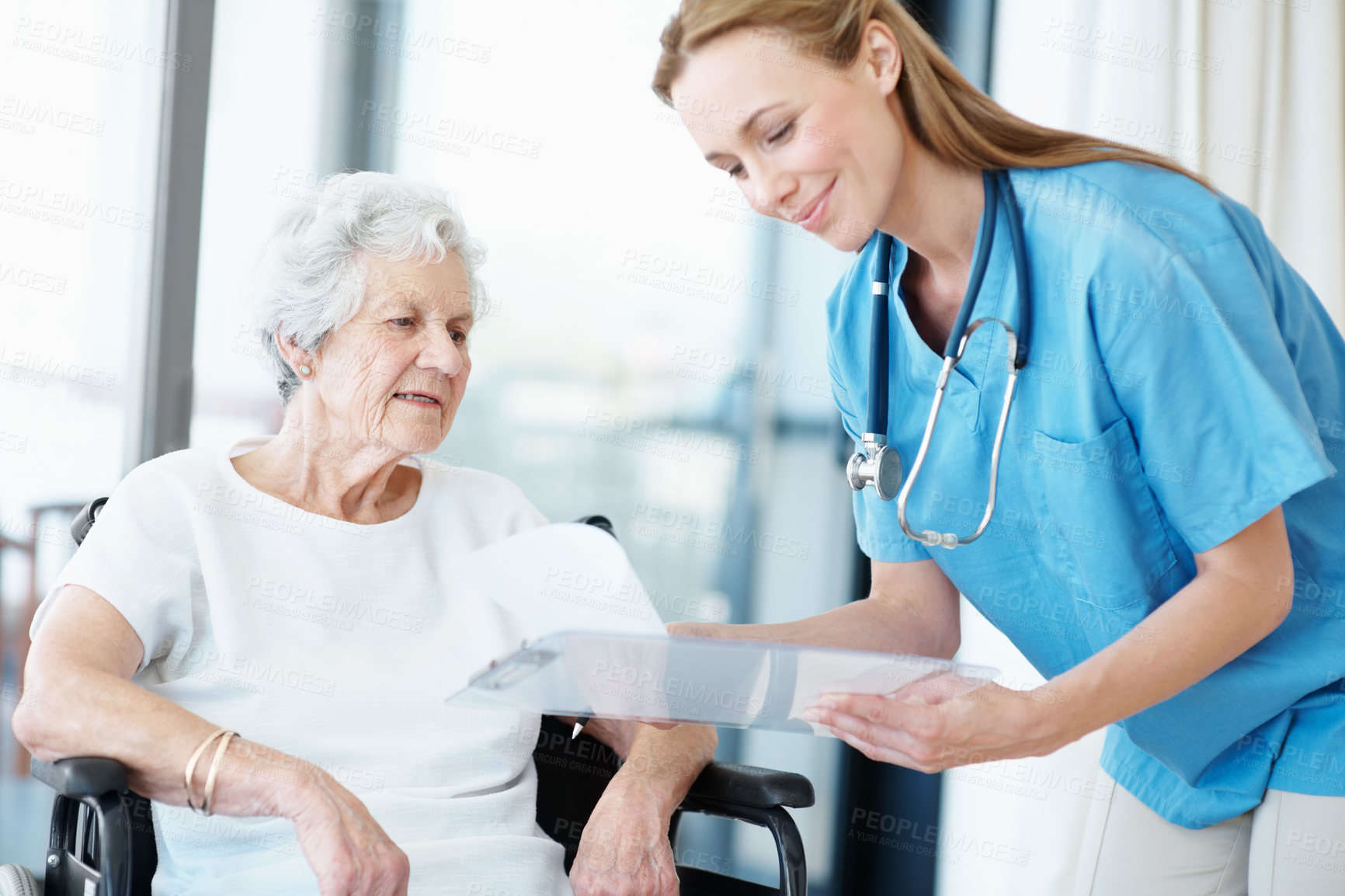 Buy stock photo Caregiver, paperwork and smile with senior woman for results, checklist and healthcare in wheelchair. Nurse, elderly patient or person with disability and happy by clipboard in retirement home