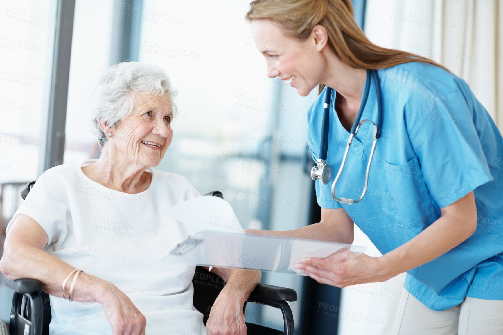 Buy stock photo Nurse, paperwork and talk with senior woman for results, checklist and healthcare in wheelchair. Caregiver, elderly patient or person with disability and happy by clipboard in retirement home