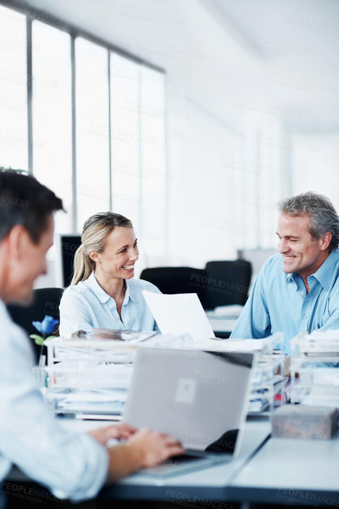 Buy stock photo Business people, coworking or meeting with documents in office, man and laptop with happy project discussion. Paperwork, team or colleagues with smile for proposal review or check report with tech