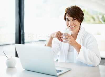 Buy stock photo Woman, morning and portrait with coffee in home, laptop for browsing or start day with smile. Female person, tech and drinking tea for wellness, break and relax in house with happiness, mug and robe