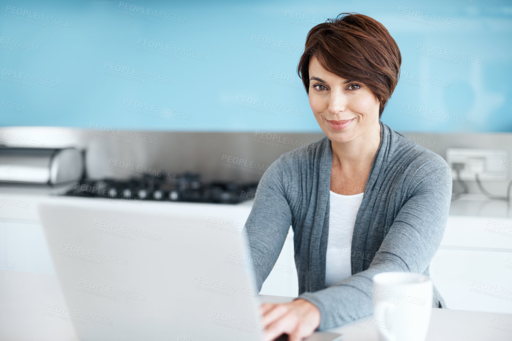Buy stock photo Kitchen, portrait and woman with laptop for remote work, editing draft or ebook research on internet. Computer, freelance author and happy person with story, typing manuscript or publication in home