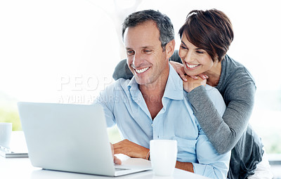 Buy stock photo Couple, hug and laugh with laptop in home, asset management and review good credit score on website. Financial planning, space and happy people with technology for savings, online and risk assessment