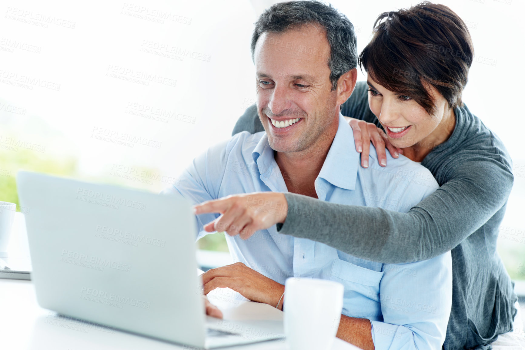 Buy stock photo Point, info and happy couple with laptop in home, asset management or review credit score on website. Financial planning, space and people with tech for savings, online and risk assessment in house
