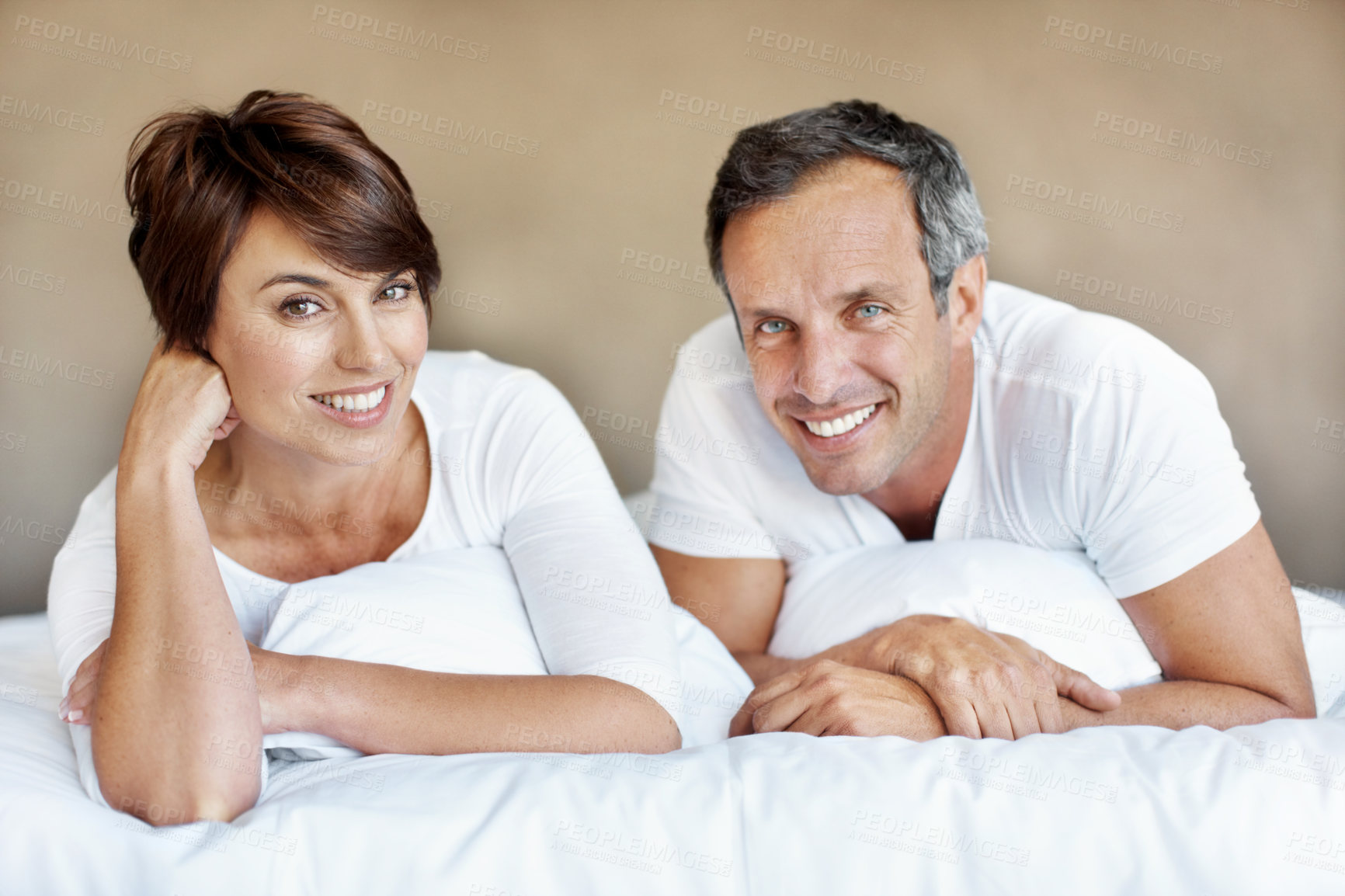 Buy stock photo Smile, morning and portrait with couple in bedroom for romance, valentines day and marriage. Happy, getaway and care with mature man and woman in home or staycation for anniversary retreat and love