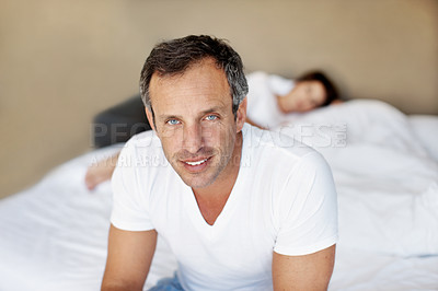 Buy stock photo Man, happy and sleeping wife in bedroom, relax or day off with good mood, morning start or calm in home. Male person, partner and smile in portrait with wellness, rest or break on weekend at house