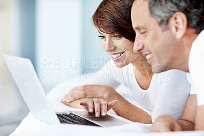 Buy stock photo Happy, laptop and woman on bed with scroll, couple and bonding with comfort and web in home. People, browsing and technology in bedroom with internet connection, streaming online and subscription
