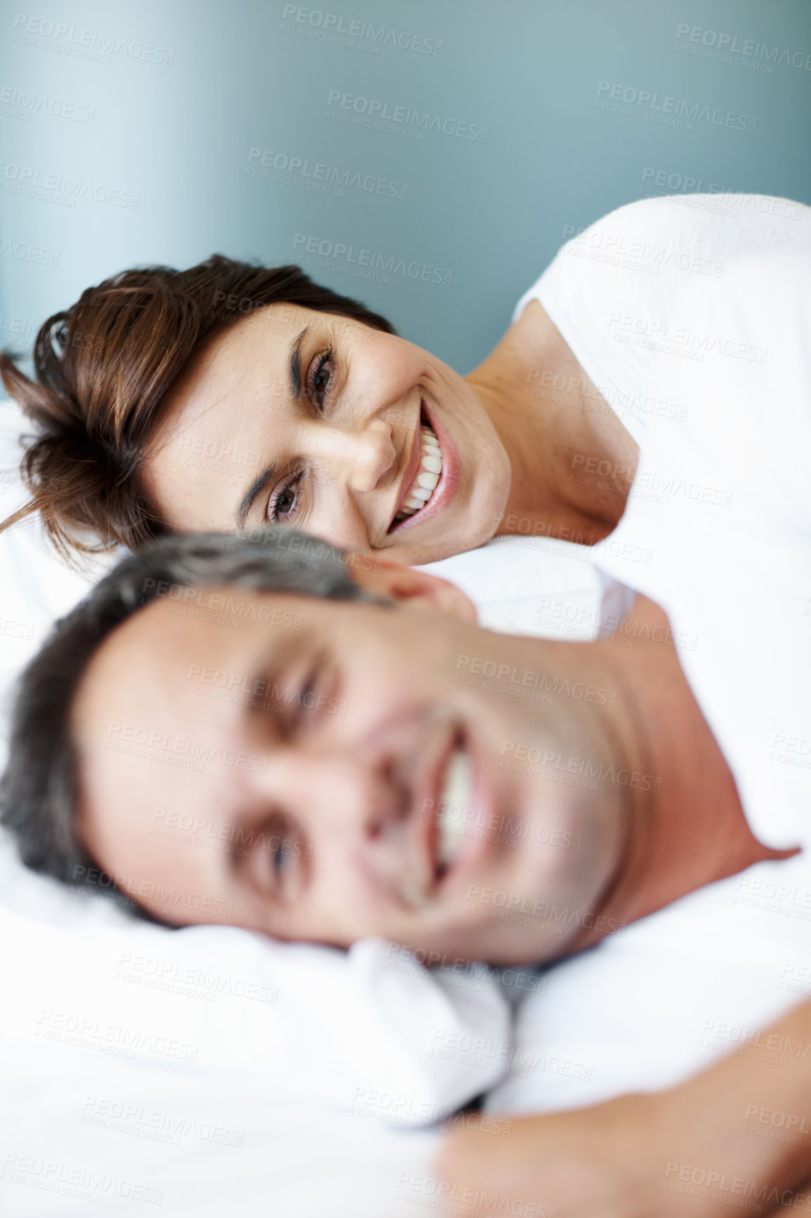 Buy stock photo Love, relax and wake up with couple in bedroom in home for smile, connection and romantic partner. Bonding, support and morning with man and woman in bed in apartment for portrait, happy and care