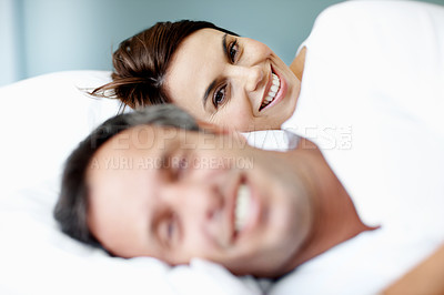 Buy stock photo Marriage, wake up and smile with woman in bedroom in home for relax, connection and romantic partner. Bonding, loyalty and morning with couple in bed in apartment for portrait, trust and happiness