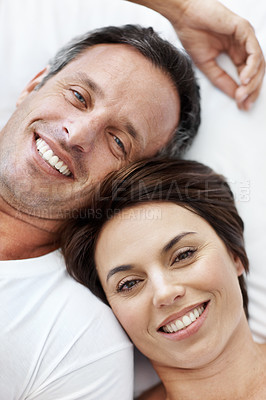 Buy stock photo Love, portrait and smile with couple in bedroom in home for wake up, connection and romantic partner. Bonding, support and morning with man and woman in bed in apartment for above, happy and care