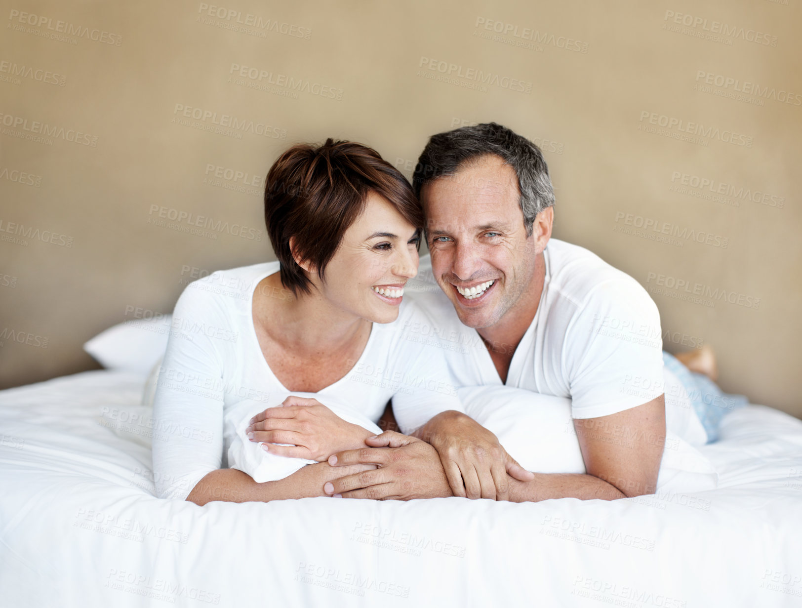 Buy stock photo Laughing, morning and love with couple in bedroom for romance, valentines day and marriage. Portrait, getaway and funny with man and woman in home or staycation for anniversary retreat and joke