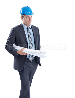 Buy stock photo Architect, man and walking with blueprints in studio for building plan on a white background. Male person, contractor or civil engineer with documents for architecture development or construction