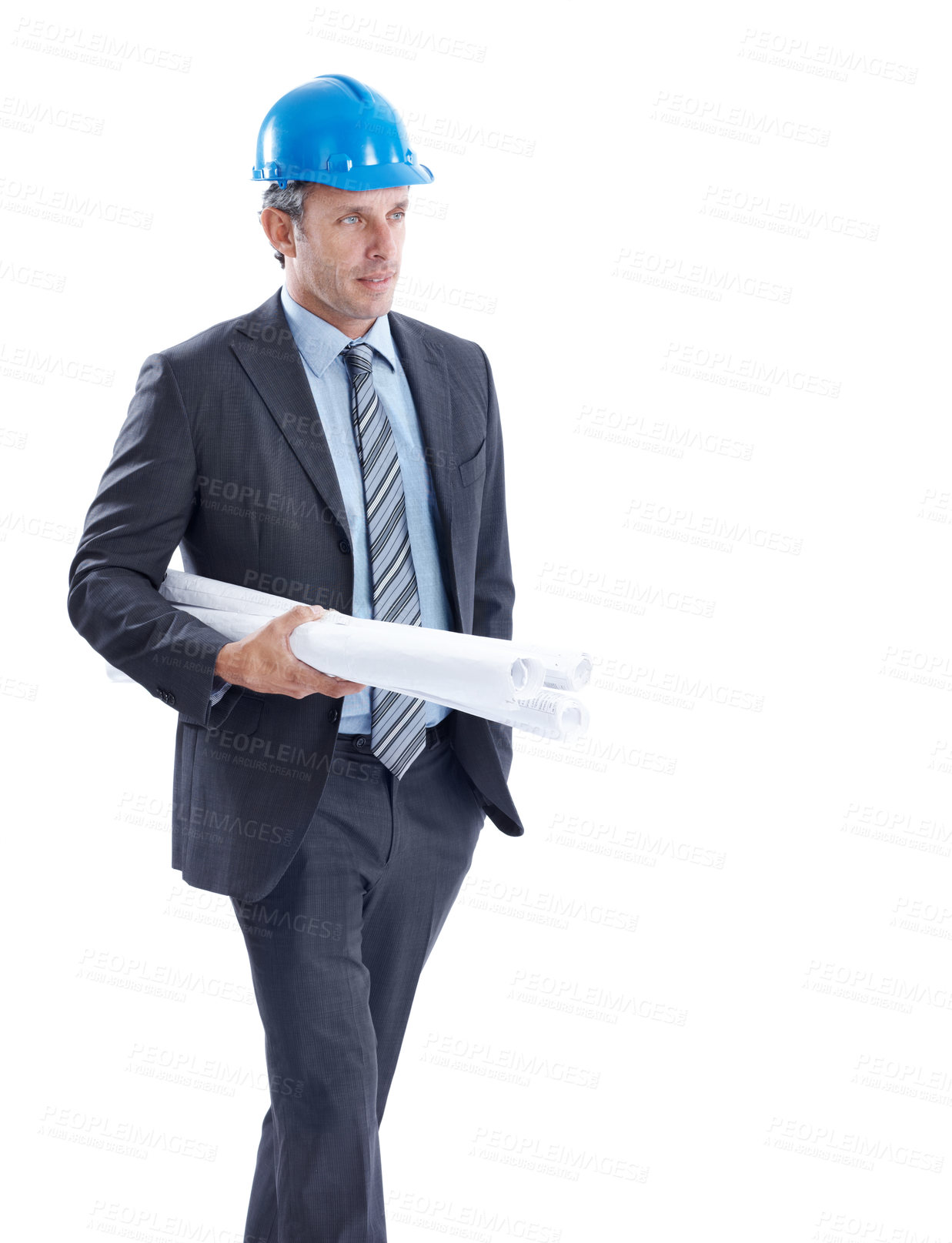 Buy stock photo Architect, man and walking with blueprints in studio for building plan on a white background. Male person, contractor or civil engineer with documents for architecture development or construction