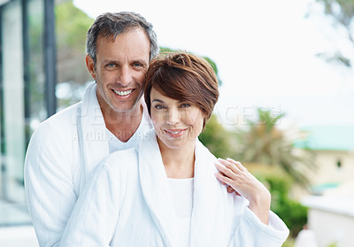 Buy stock photo Portrait, couple and smile on balcony with love, affection and bonding together at holiday resort. Happy, people and terrace at hotel with romance, healthy relationship and connection for vacation