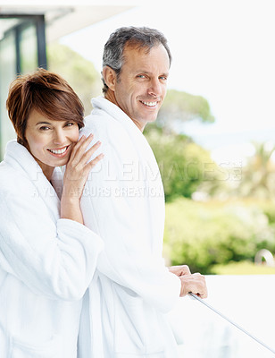 Buy stock photo Happy, couple and relax on balcony with love, affection and bonding together at holiday resort. Portrait, people and terrace at hotel for fresh air, healthy relationship and commitment for vacation