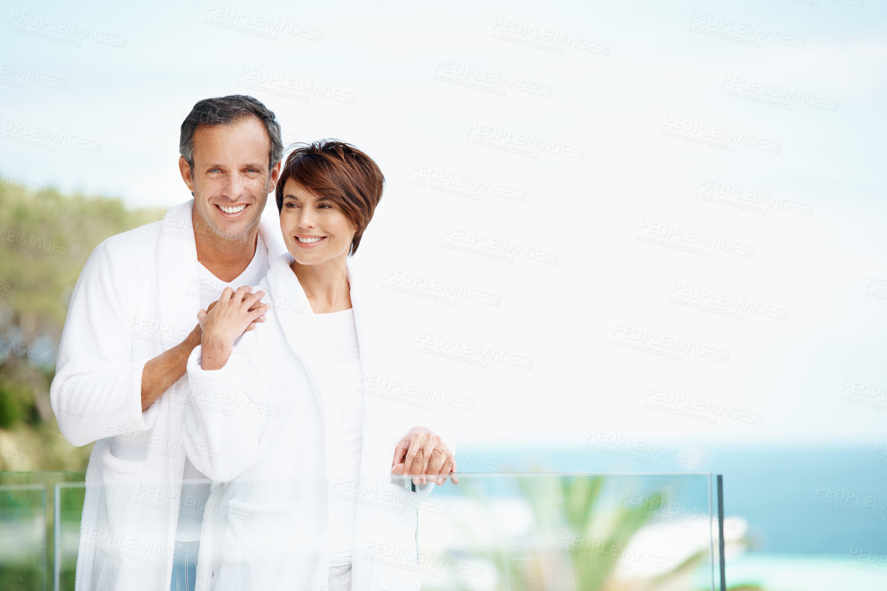 Buy stock photo Love, hug and balcony with couple at hotel for travel, anniversary getaway and bonding. Marriage, holiday villa and portrait with man and woman relax at resort for view, mockup space and support