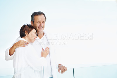 Buy stock photo Thinking, couple and love on balcony with hug, affection or bonding together at holiday resort. Space, people and terrace at hotel for fresh air, healthy relationship and view on anniversary vacation