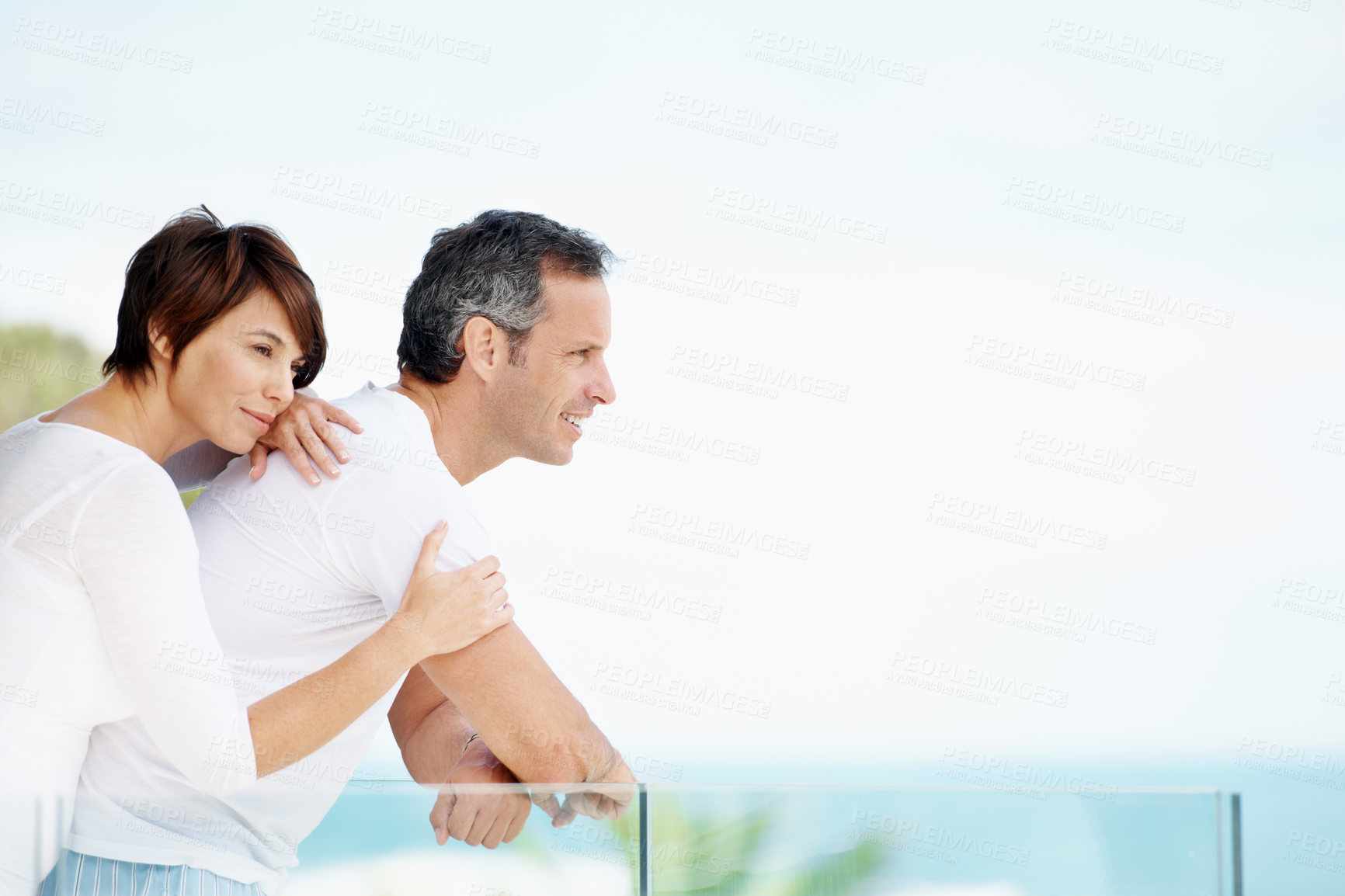 Buy stock photo Calm, thinking or couple on balcony with hug, trip memory or tender perspective on romantic vacation. Relax, space and people with embrace, peaceful reflection or marriage nostalgia on summer holiday